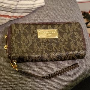 Michael Kors double zip wallet.